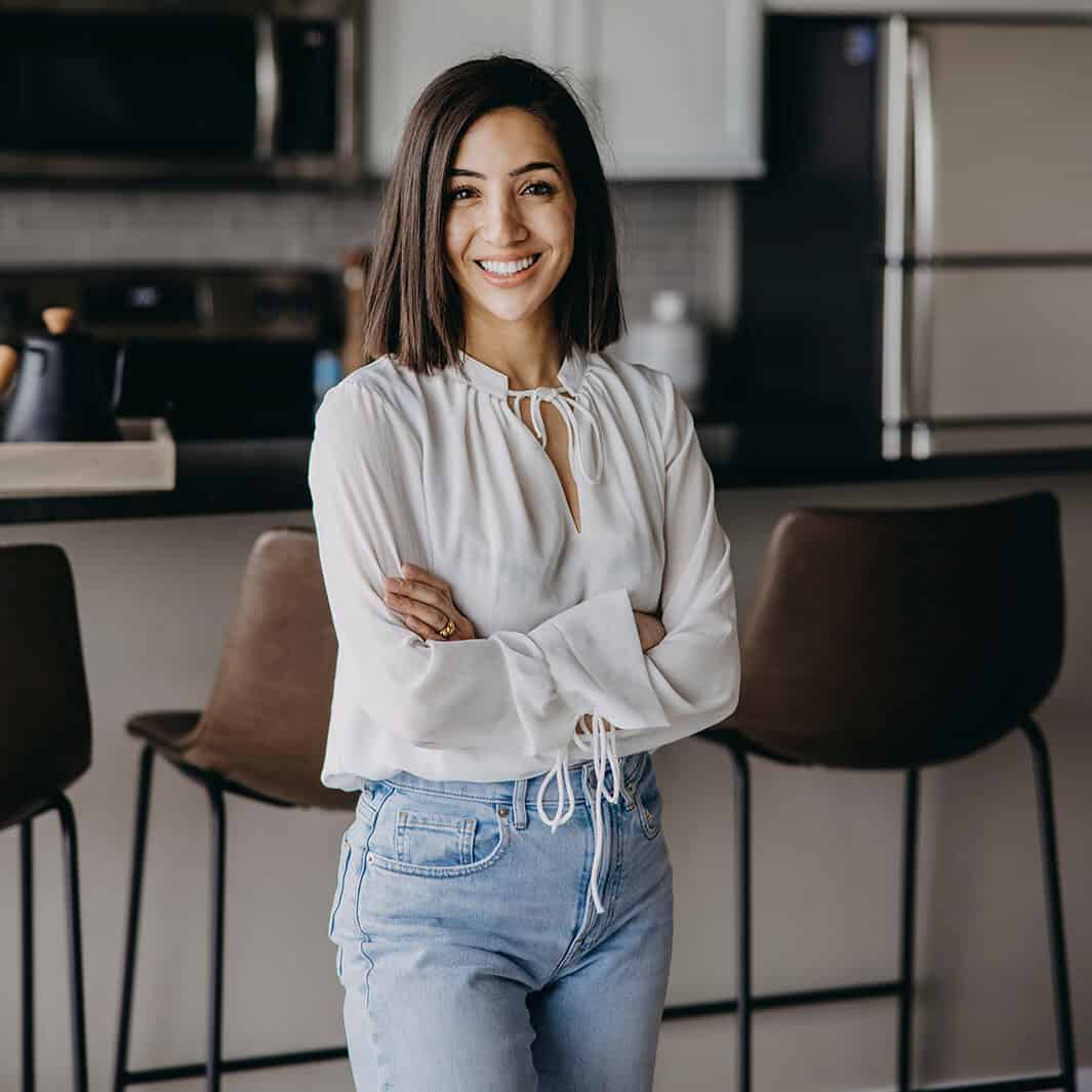 Weight loss dietitian standing in kitchen
