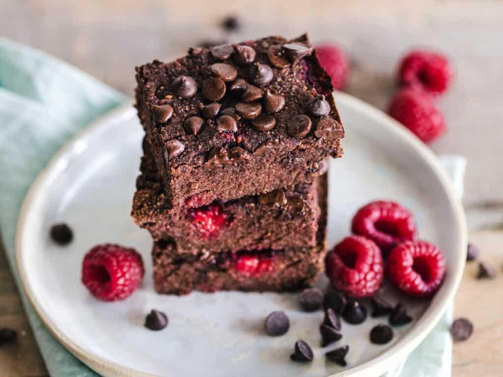 plate of brownies with raspberries a plate of brownies with raspberries