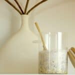 healthy overnight oats recipe for weight loss in a mason jar in front of a vase
